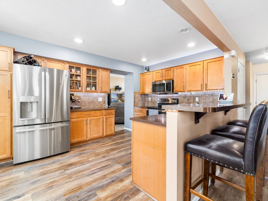 Kitchen with maple cabinets and a breakfast bar